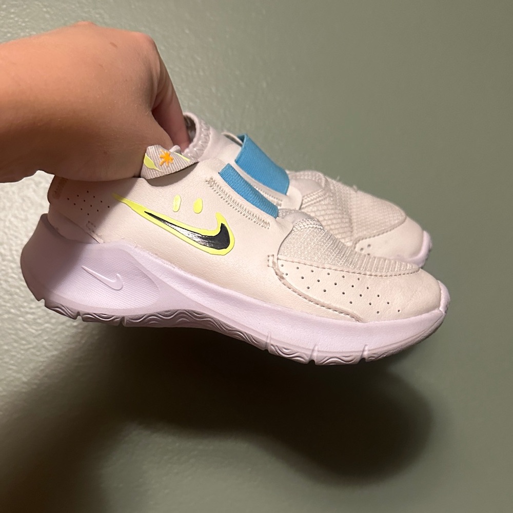 Nike Kids White Slip-On Sneakers with Blue Strap and Neon Yellow Swoosh